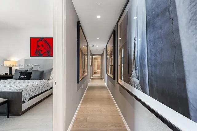 a bedroom with a bed and a lamp next to a window