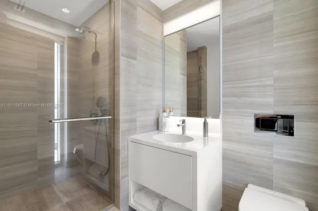 a spacious bedroom with a bed and glass window