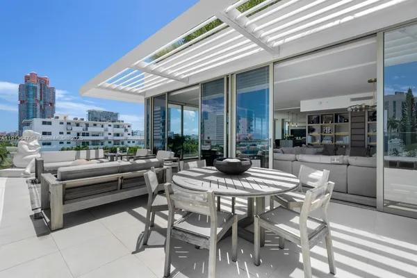 a view of an outdoor dining space with furniture