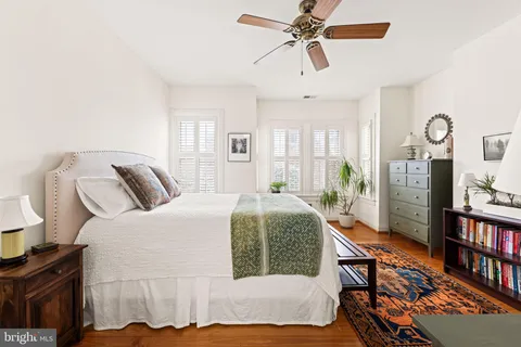 a view of a porch with plants and chairs