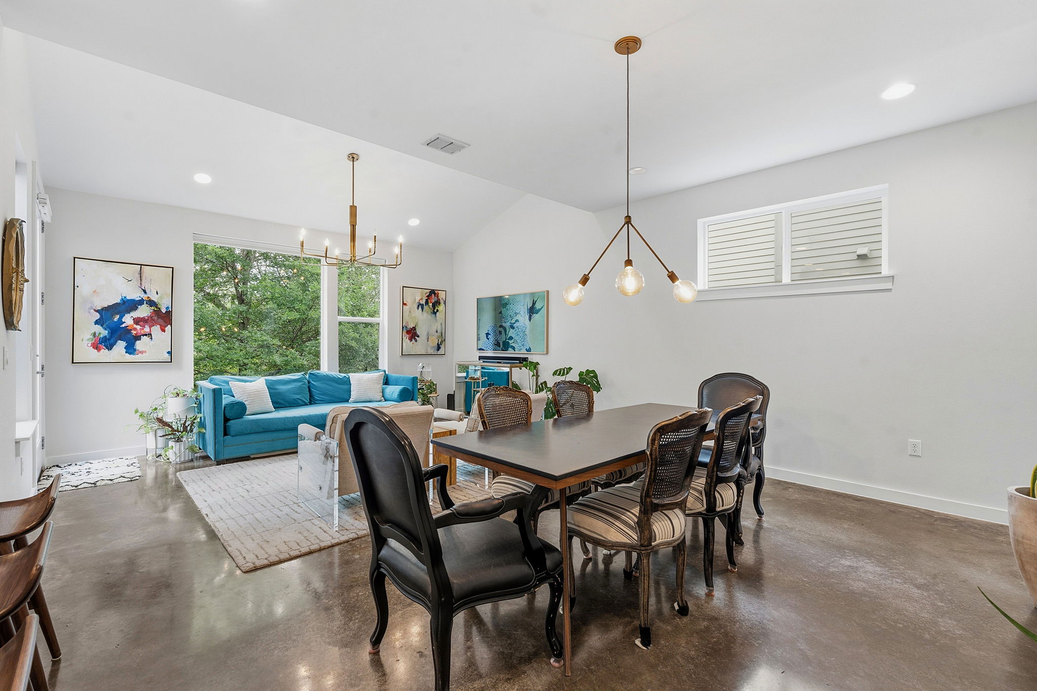 3001 Del Curto Road, Unit 31 Austin, TX 78704 - Photo 10 of 32 a view of a dining room with furniture window and wooden floor
