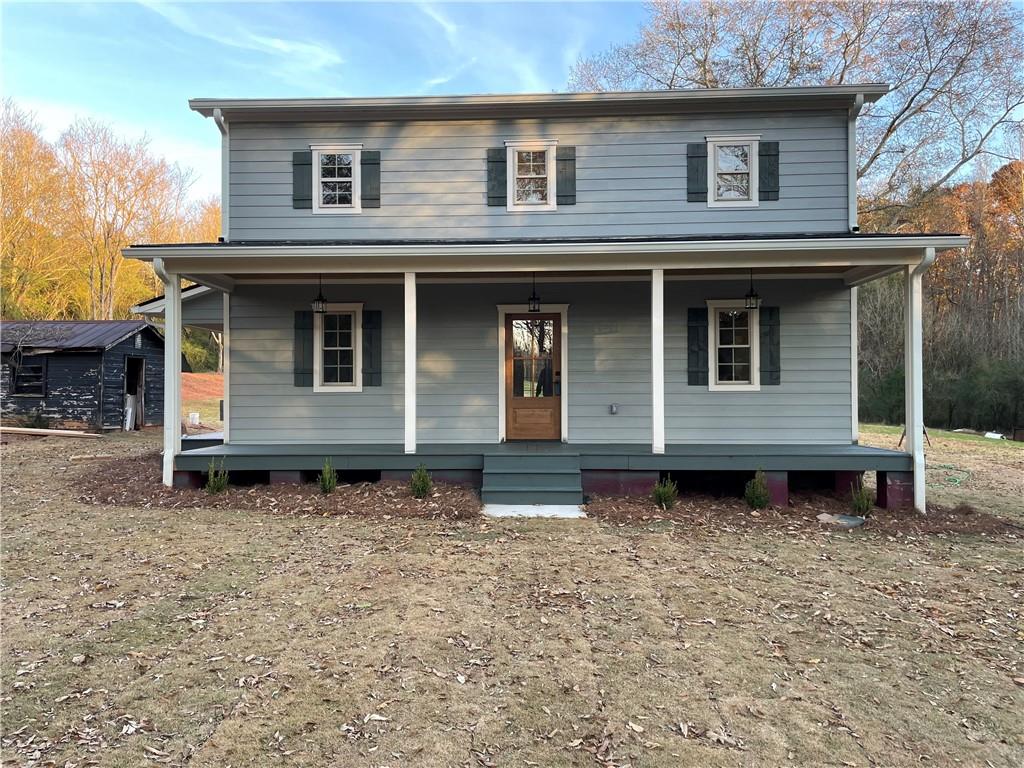 a house with trees in the background