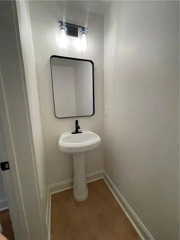 a bathroom with a sink and mirror