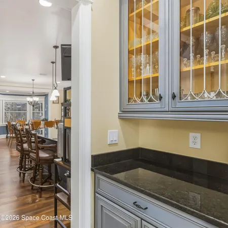 a living room with fireplace furniture and a wooden floor