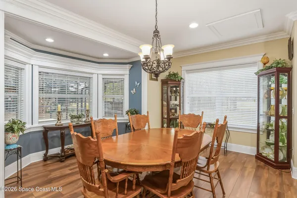 a bedroom with furniture and wooden floor