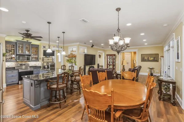 a bedroom with furniture and a chandelier