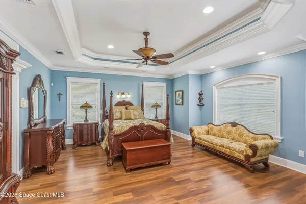 a living room with fireplace furniture and a large window