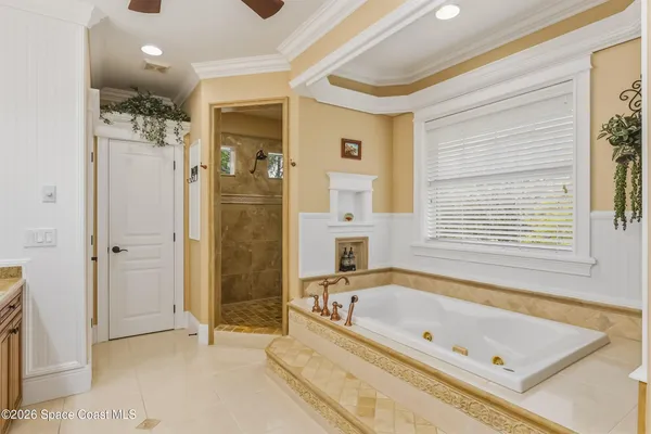 a bathroom with a bathtub and a shower