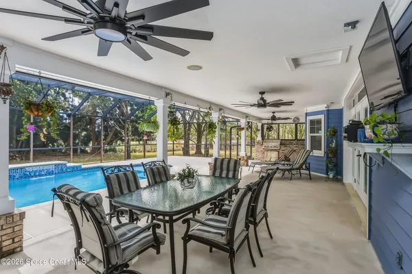 a view of a lake with a yard and mountain view