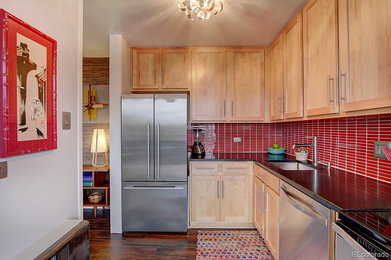 1200 Vine Street, Unit 4B Denver, CO 80206 - Photo 15 of 33 a kitchen with a sink cabinets and stainless steel appliances