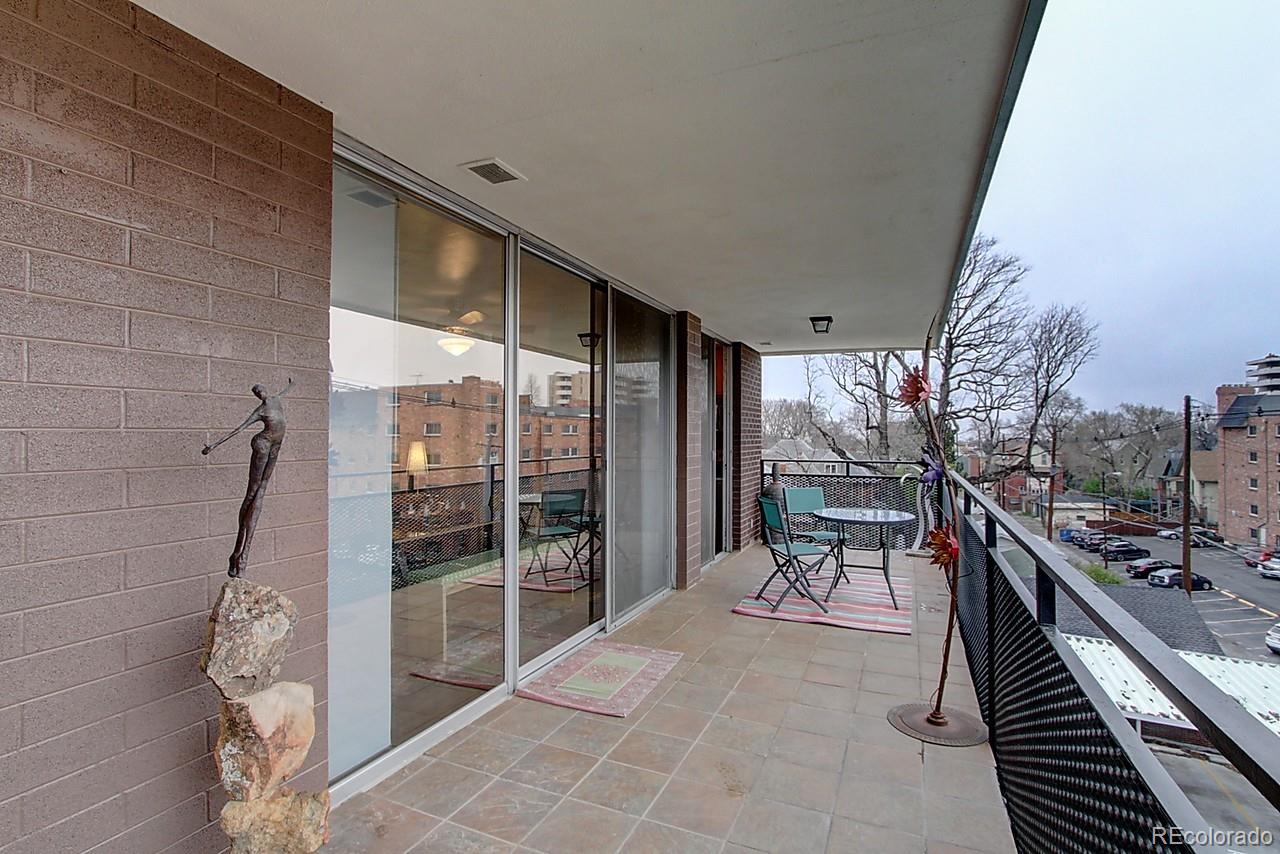 1200 Vine Street, Unit 4B Denver, CO 80206 - Photo 18 of 33 a balcony with furniture and a gate