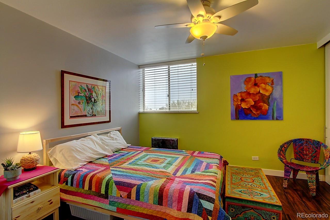 1200 Vine Street, Unit 4B Denver, CO 80206 - Photo 20 of 33 a bedroom with a bed and painting on the wall