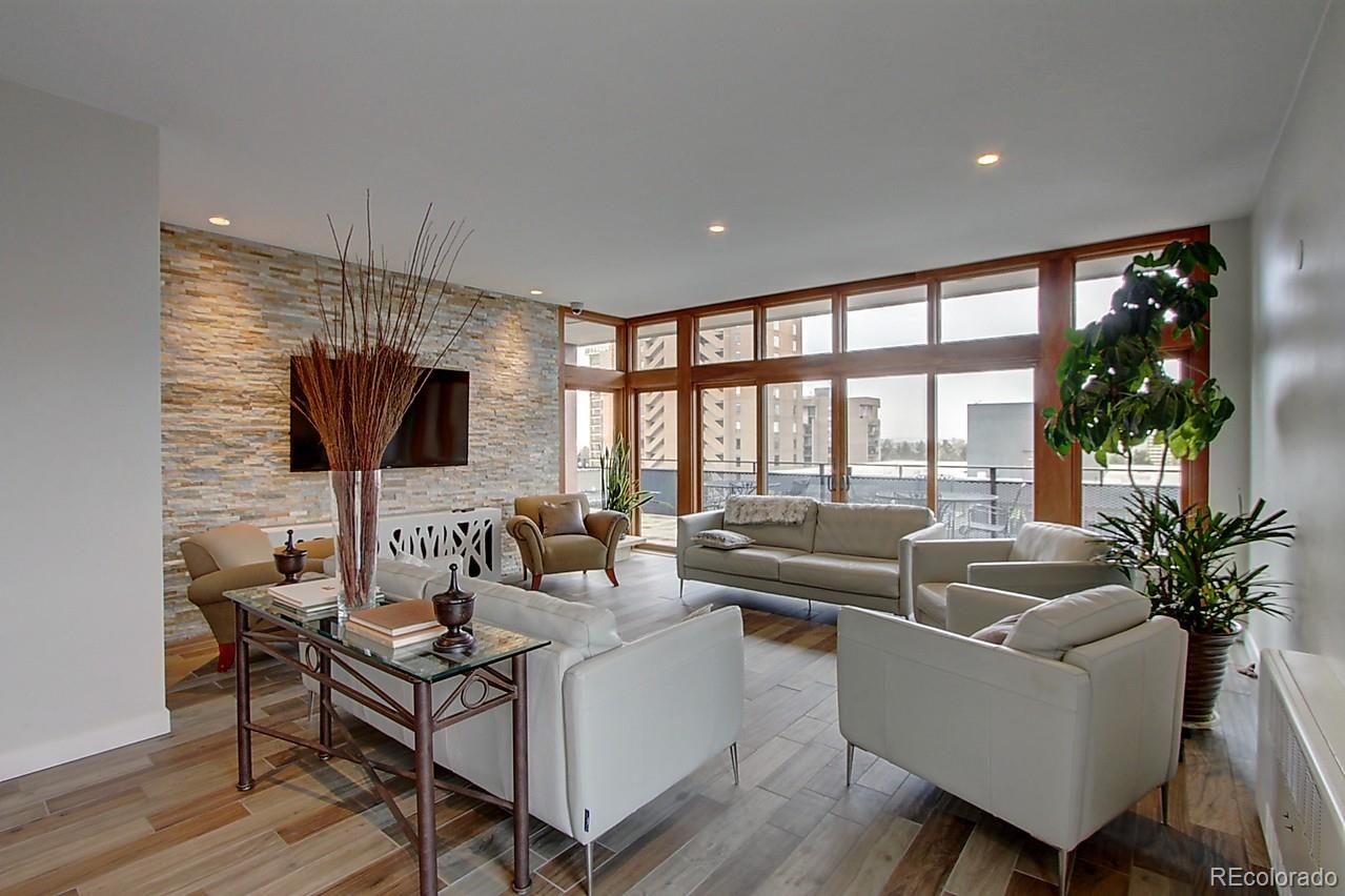 1200 Vine Street, Unit 4B Denver, CO 80206 - Photo 23 of 33 a living room with furniture and a flat screen tv