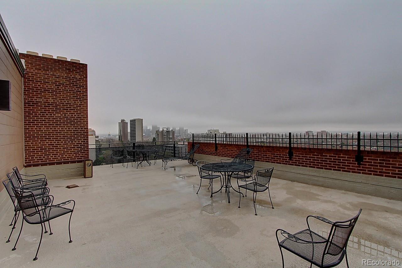 1200 Vine Street, Unit 4B Denver, CO 80206 - Photo 25 of 33 a terrace with a bench and chairs