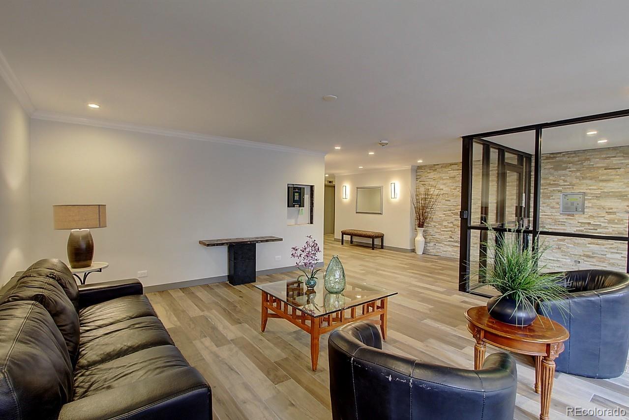 1200 Vine Street, Unit 4B Denver, CO 80206 - Photo 32 of 33 a living room with furniture and a window