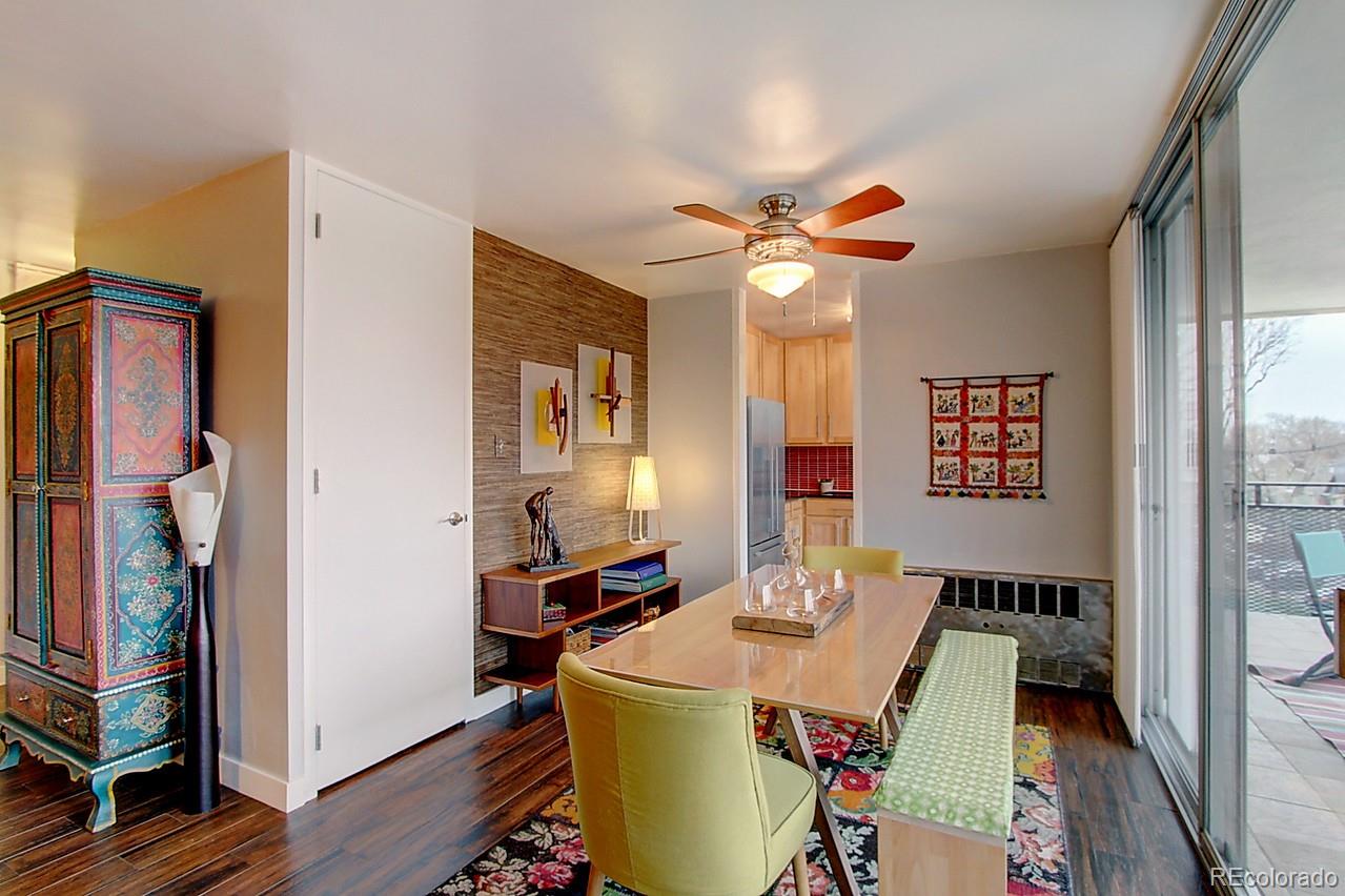 1200 Vine Street, Unit 4B Denver, CO 80206 - Photo 7 of 33 a dining room with furniture and wooden floor
