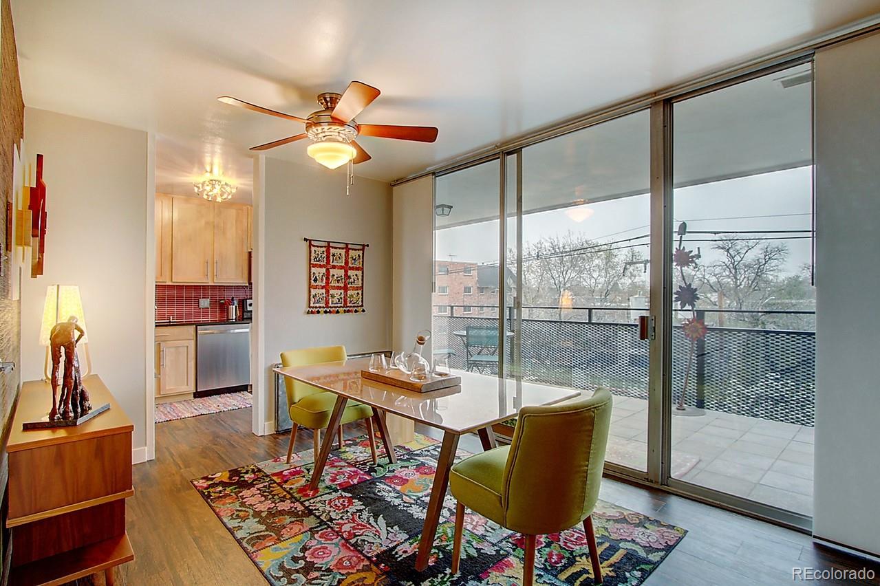 1200 Vine Street, Unit 4B Denver, CO 80206 - Photo 8 of 33 a living room with furniture and a large window