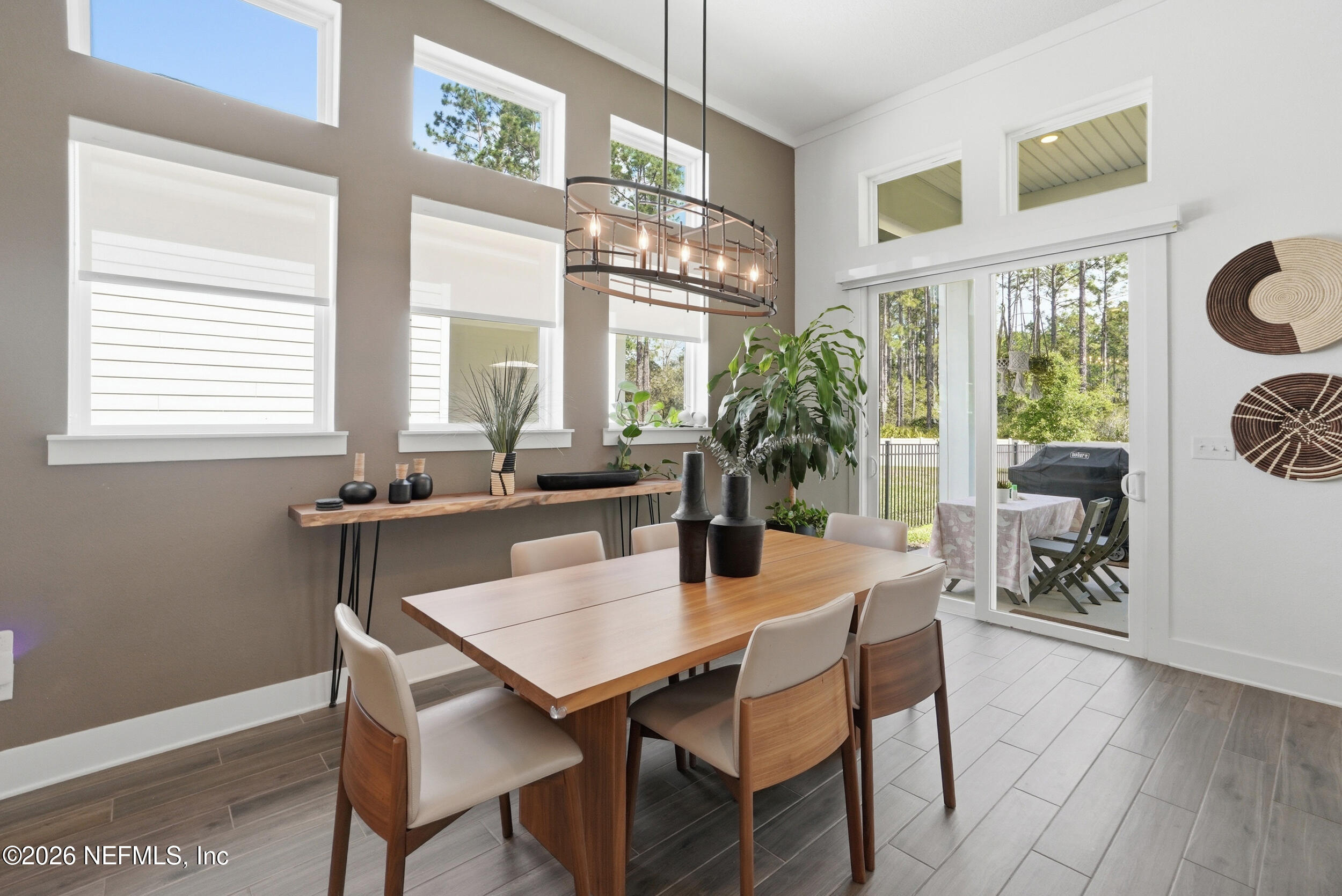 728 Navigators Road St. Johns, FL 32259 - Photo 11 of 38 a dining room with furniture a chandelier and wooden floor