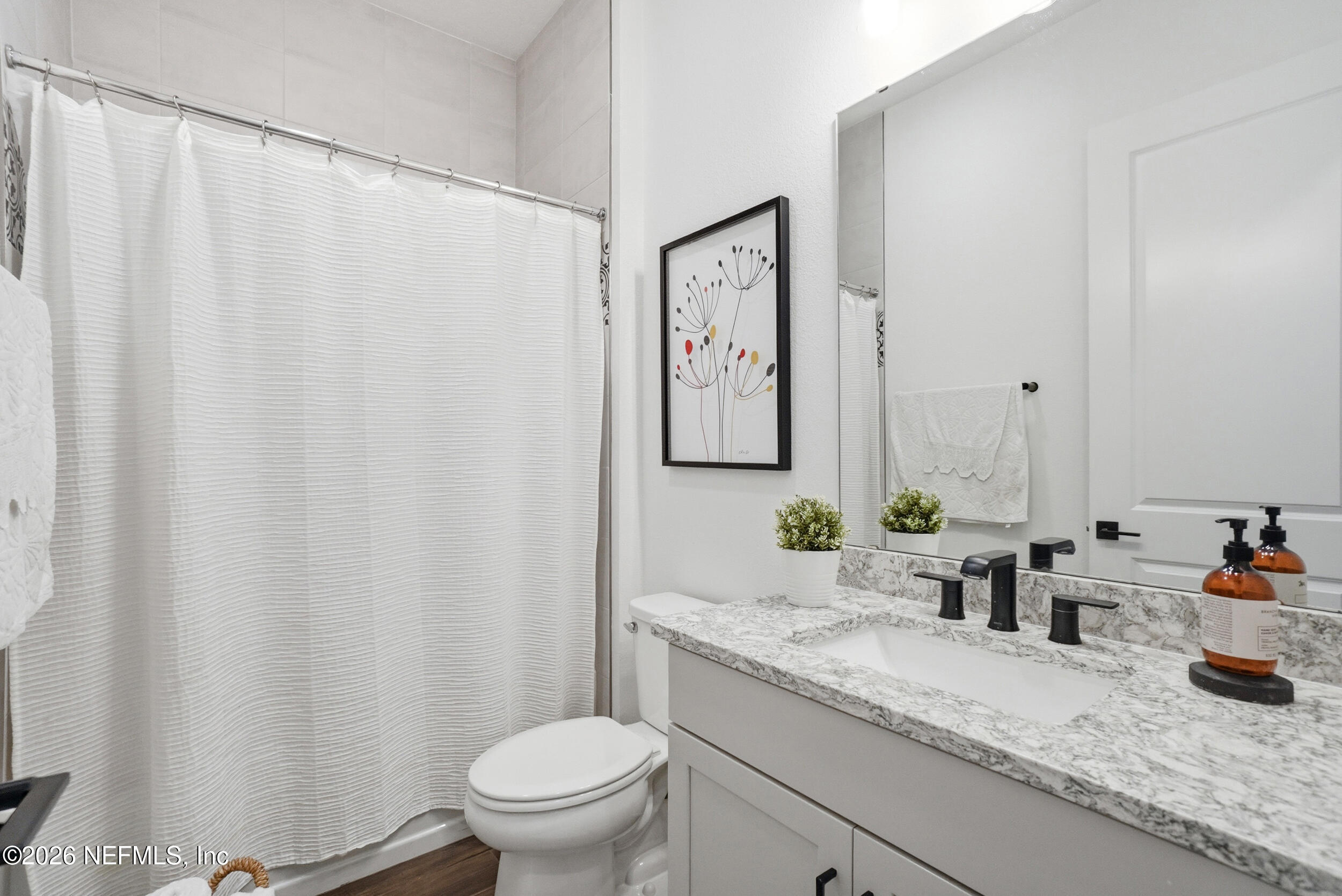 728 Navigators Road St. Johns, FL 32259 - Photo 20 of 38 a bathroom with a granite countertop sink and a mirror