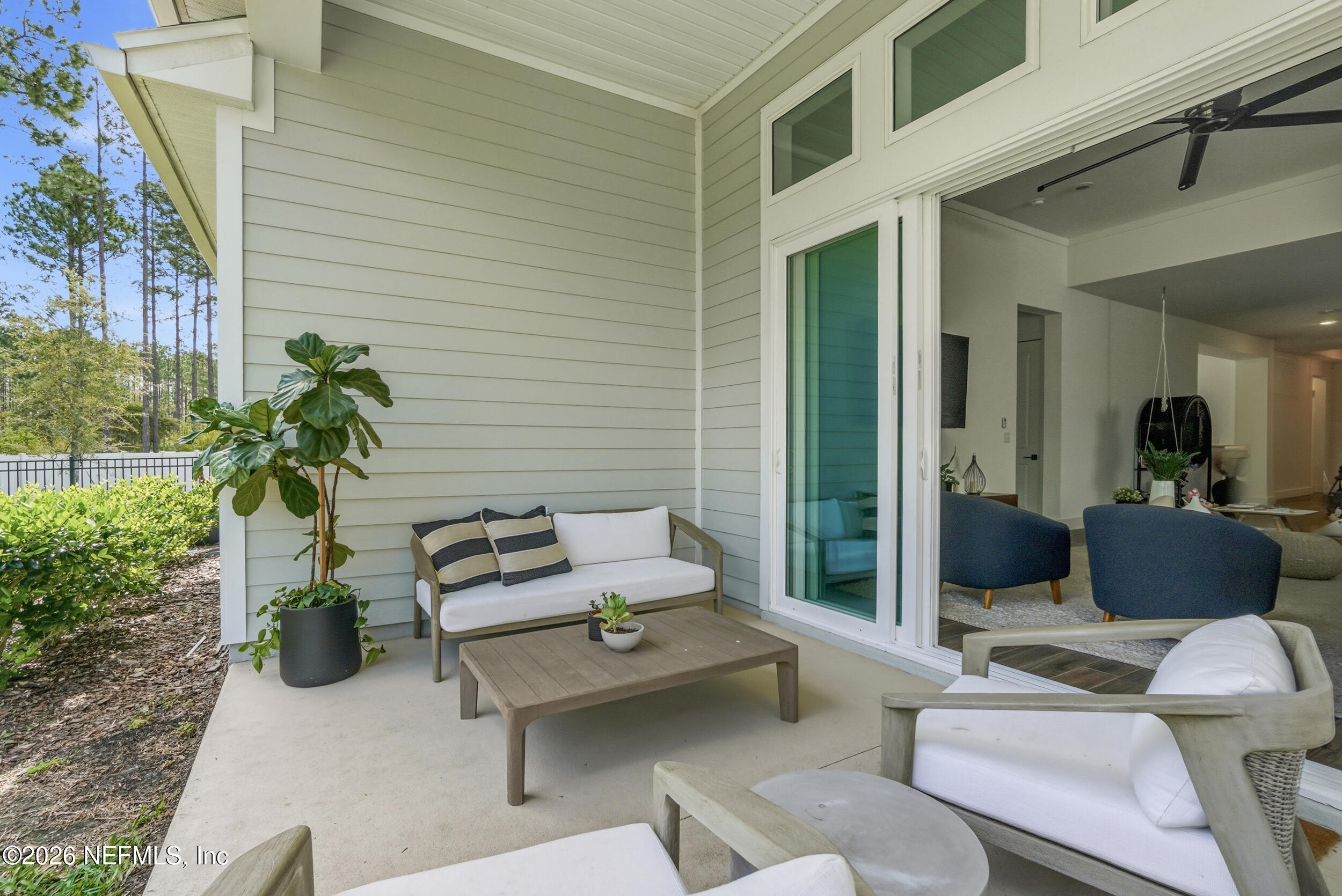 728 Navigators Road St. Johns, FL 32259 - Photo 25 of 38 a patio with patio couch and potted plants