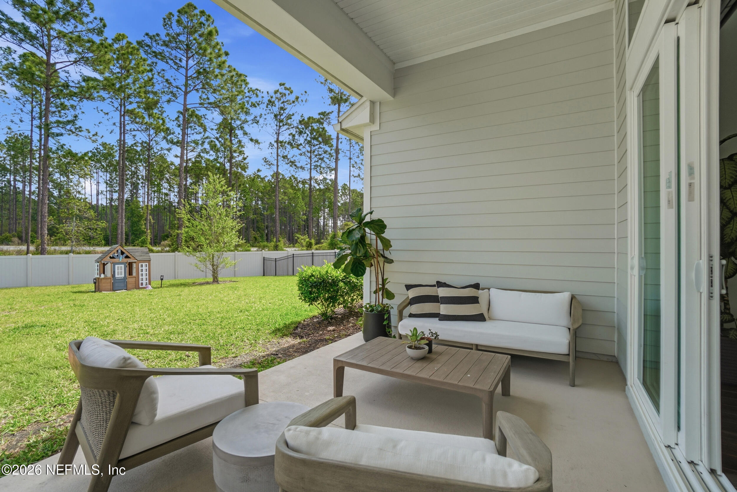 728 Navigators Road St. Johns, FL 32259 - Photo 26 of 38 a view of a backyard with sitting area