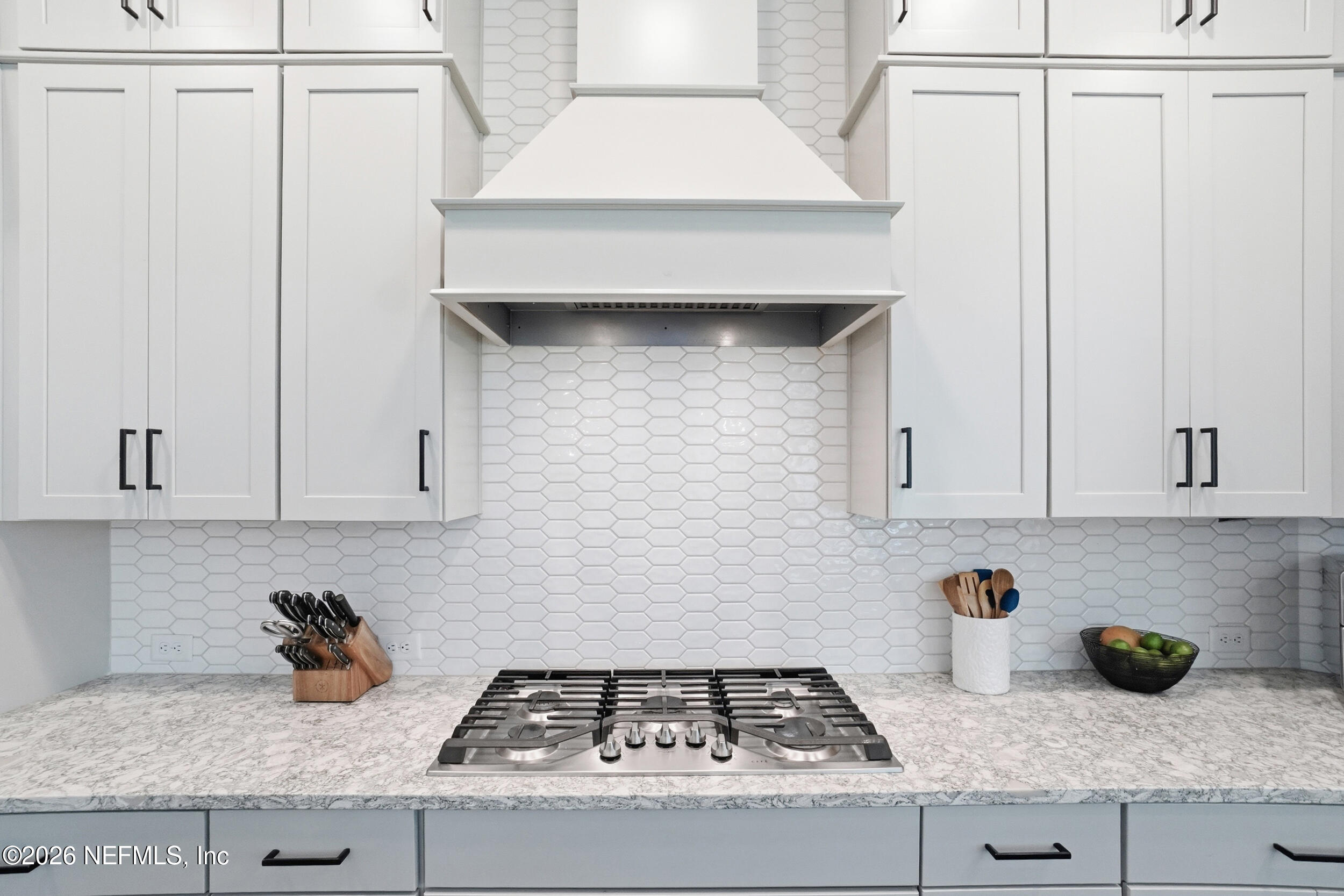 728 Navigators Road St. Johns, FL 32259 - Photo 9 of 38 a kitchen with an oven a cabinets and a stove