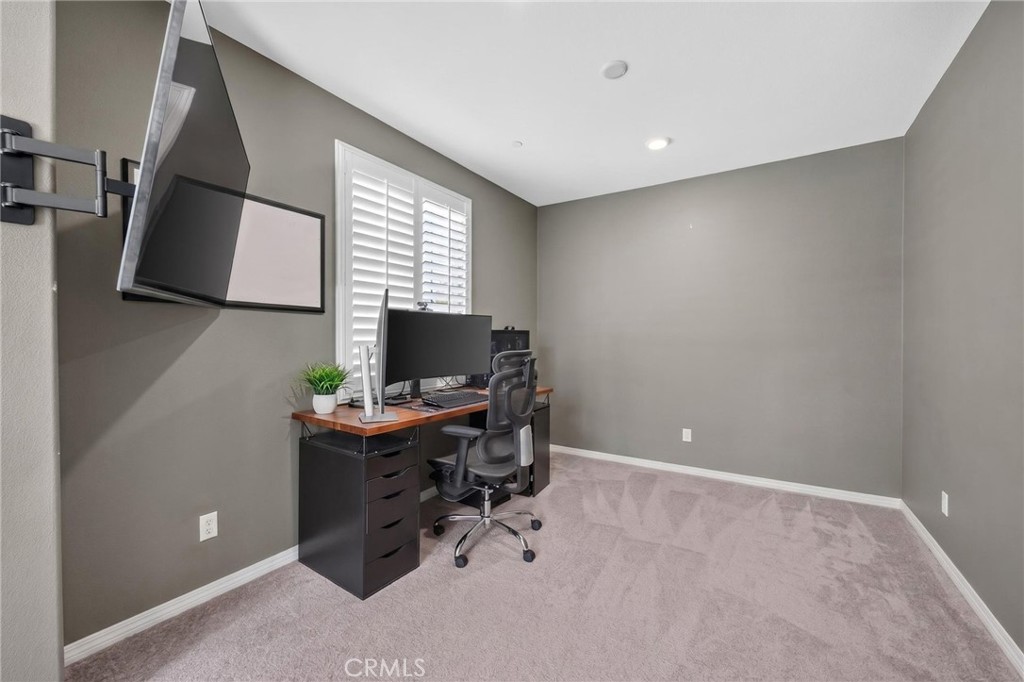 23347 Crystal Way Wildomar, CA 92595 - Photo 49 of 109 a view of a workspace with furniture and a window