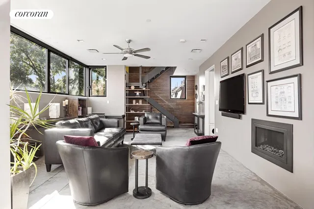 a kitchen with stainless steel appliances kitchen island sink stove and cabinets