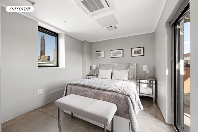 a living room with furniture fireplace and a large window