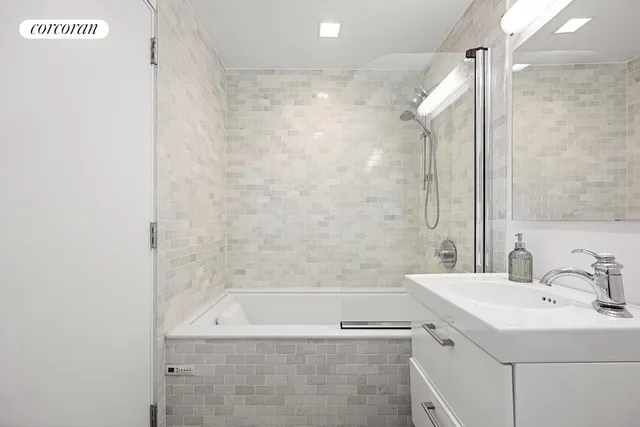 a bedroom with a bed and a lamp