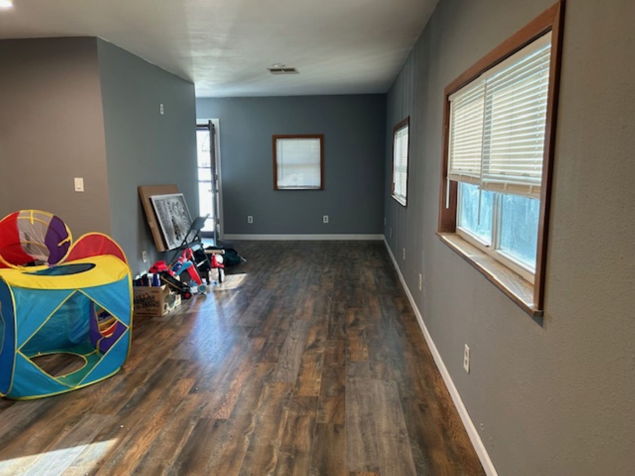 34743 Betka Road Waller, TX 77484 - Photo 11 of 20 a living room with furniture and a wooden floor