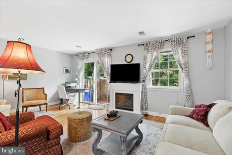 a living room with furniture and a rug