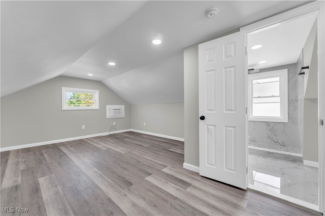 4124 Bayard Road Cleveland, OH 44121 - Photo 23 of 35 Bonus room with vaulted ceiling, light wood-type flooring, and recessed lighting