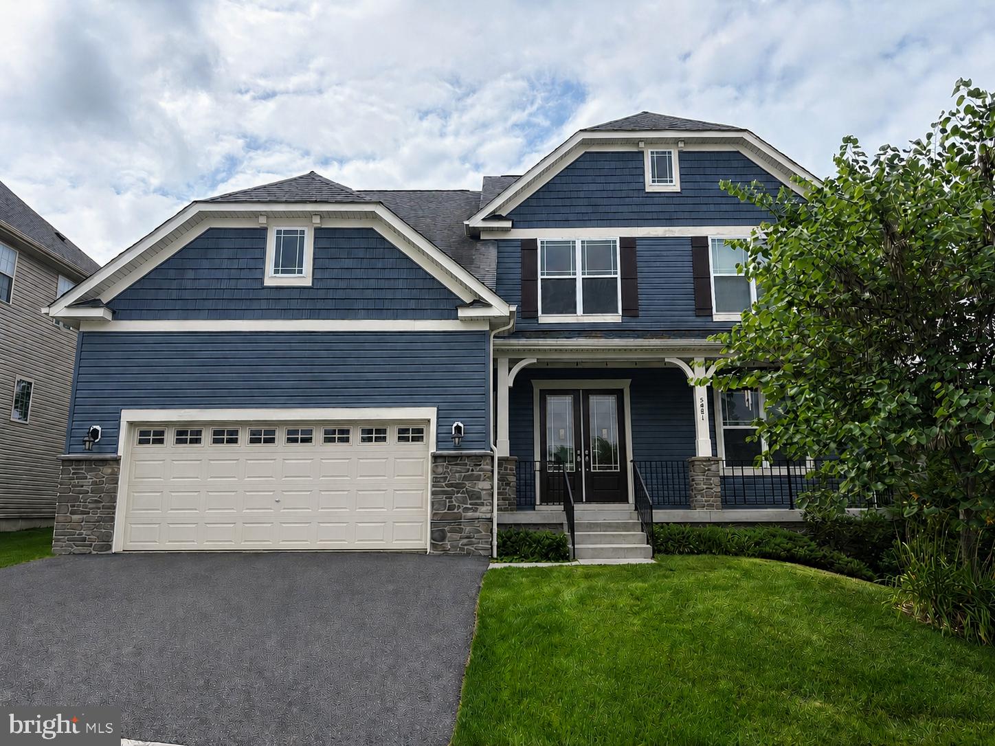5481 Tallyn Ridge Drive Frederick, MD 21704 - Photo 1 of 1 Charming blue home with lush greenery.