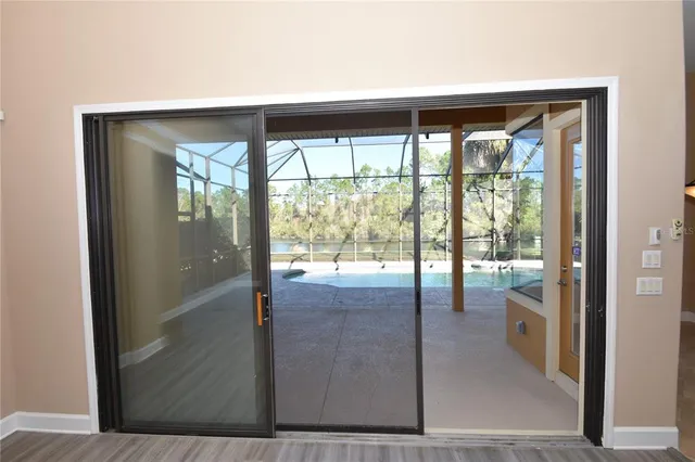 a swimming pool with outdoor seating and yard