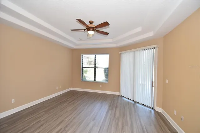 a bathroom with a glass shower door and a bathtub