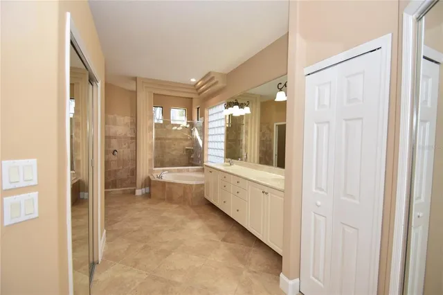a bathroom with a bathtub and shower