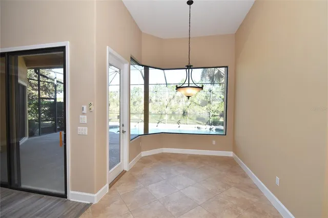 a kitchen with stainless steel appliances granite countertop a sink microwave and cabinets