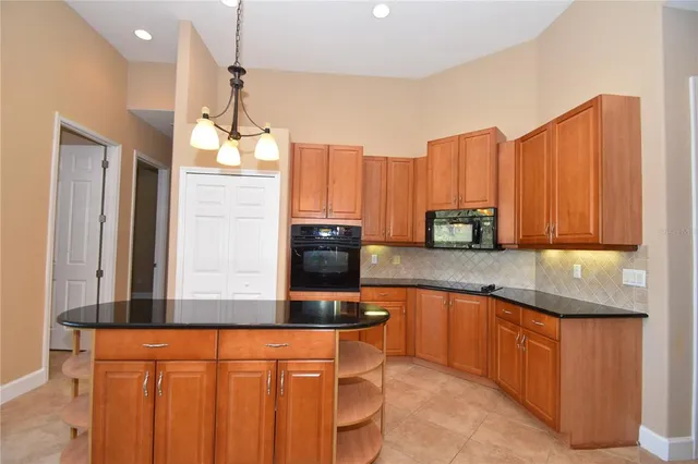 a bathroom with a sink a toilet a mirror and shower