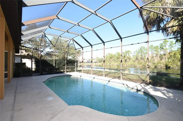 a view of a swimming pool with a patio