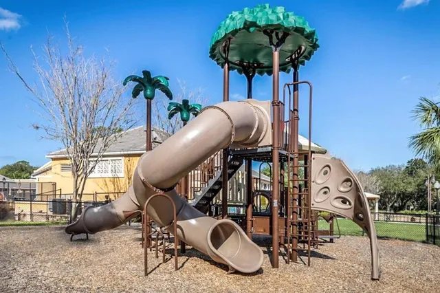 a view of a house with a backyard porch and sitting area