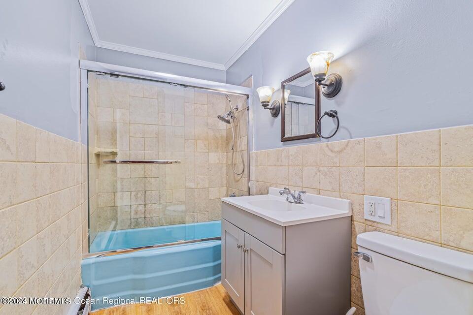 1 Dolphin Way Waretown, NJ 08758 - Photo 13 of 15 a bathroom with a sink a toilet and shower