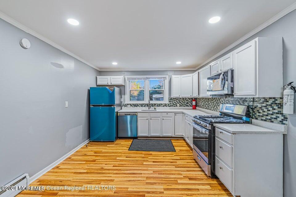 1 Dolphin Way Waretown, NJ 08758 - Photo 14 of 15 a kitchen with stainless steel appliances granite countertop a refrigerator sink and cabinets