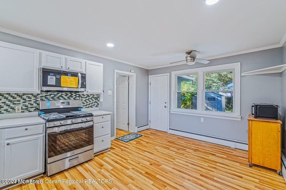 1 Dolphin Way Waretown, NJ 08758 - Photo 15 of 15 a bedroom with a bed and a stove top oven
