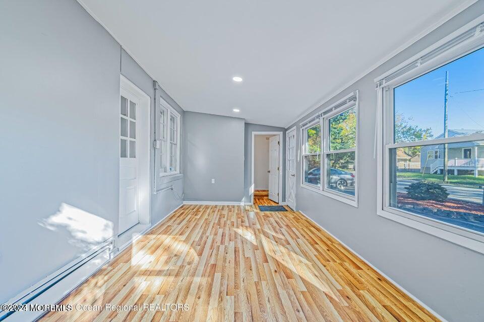 1 Dolphin Way Waretown, NJ 08758 - Photo 4 of 15 a view of a bedroom with wooden floor and windows