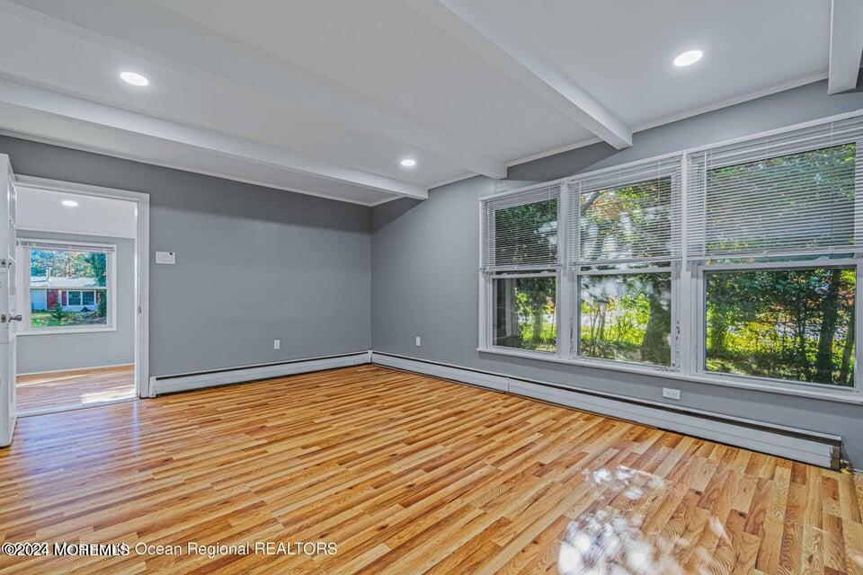 1 Dolphin Way Waretown, NJ 08758 - Photo 6 of 15 wooden floor in an empty room with a window