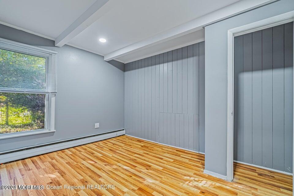 1 Dolphin Way Waretown, NJ 08758 - Photo 9 of 15 a view of empty room with wooden floor and fan