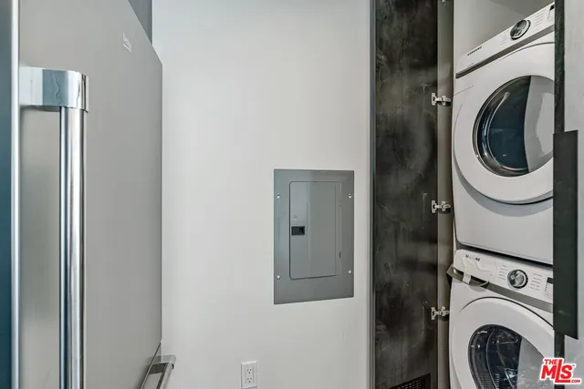 a close view of a utility room with dryer and washer