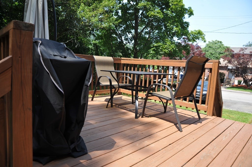 37 Raechel Road, Unit 37 Randolph, MA 02368 - Photo 4 of 15 a view of balcony with wooden floor and outdoor seating