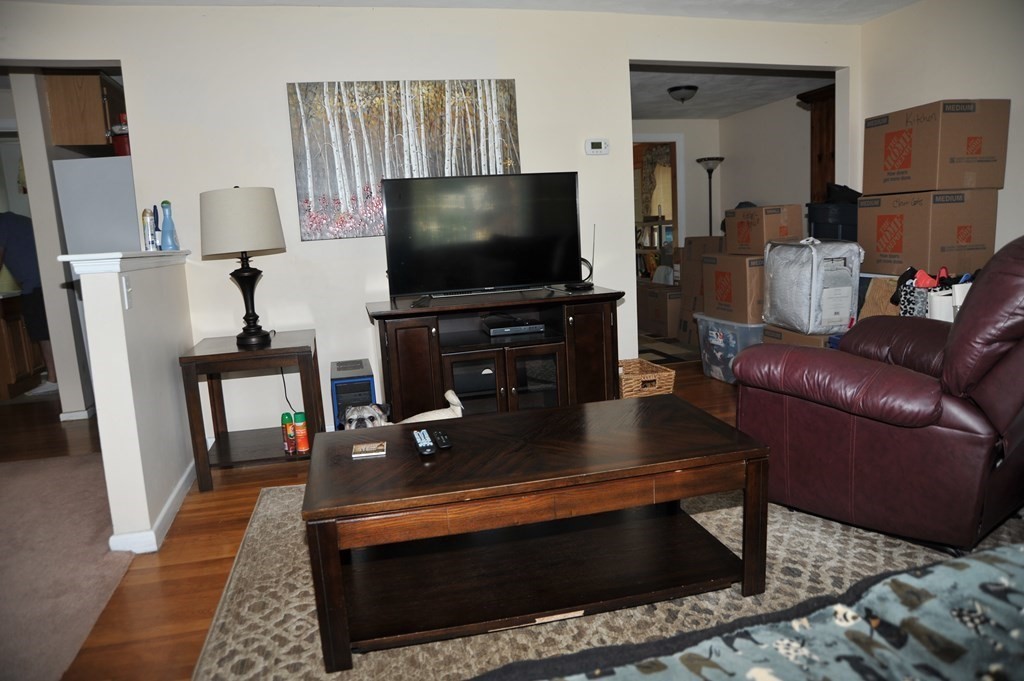 37 Raechel Road, Unit 37 Randolph, MA 02368 - Photo 5 of 15 a living room with furniture and a flat screen tv
